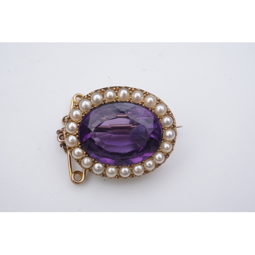 330 - An amethyst and split pearl brooch, circa 1900, of oval outline, set with an oval amethyst within a ... 