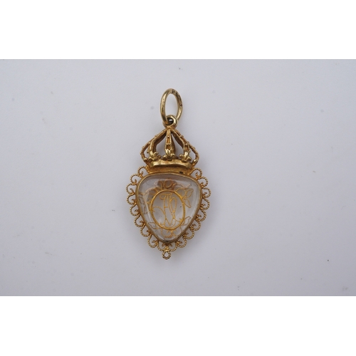 332 - An unusual gold pendant, late 18th/early 19th century, designed as a heart-shaped glazed compartment... 