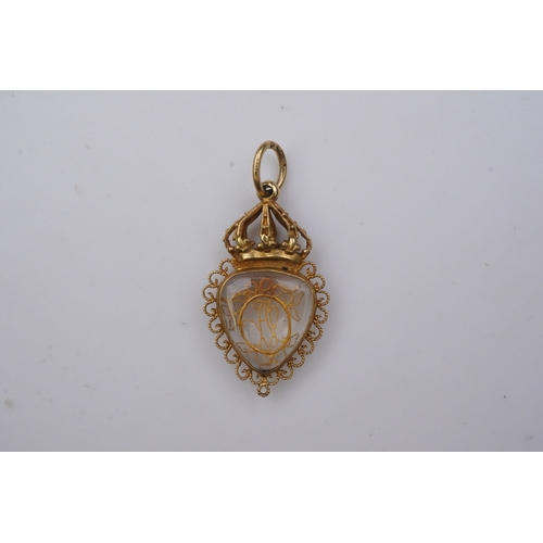 332 - An unusual gold pendant, late 18th/early 19th century, designed as a heart-shaped glazed compartment... 