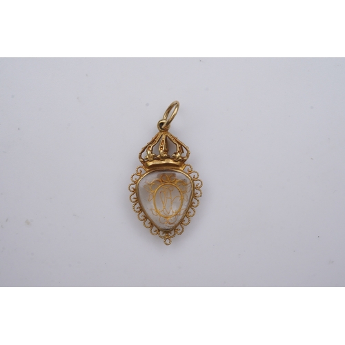 332 - An unusual gold pendant, late 18th/early 19th century, designed as a heart-shaped glazed compartment... 