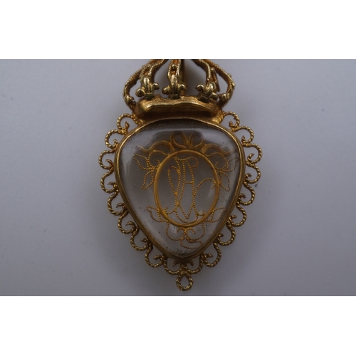 332 - An unusual gold pendant, late 18th/early 19th century, designed as a heart-shaped glazed compartment... 