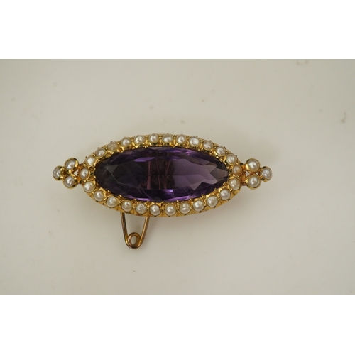 333 - An amethyst and pearl brooch, circa 1900, set with an elongated oval amethyst, bordered with half pe... 