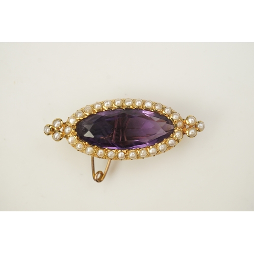 333 - An amethyst and pearl brooch, circa 1900, set with an elongated oval amethyst, bordered with half pe... 