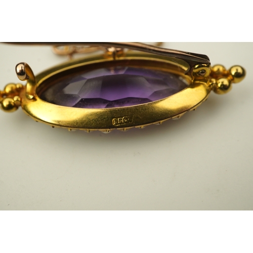 333 - An amethyst and pearl brooch, circa 1900, set with an elongated oval amethyst, bordered with half pe... 