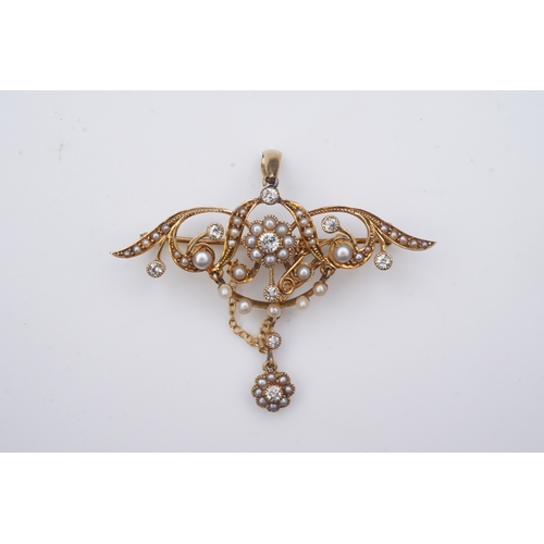 334 - An Edwardian seed pearl and diamond brooch, early 20th century, of foliate design, suspending a fest... 