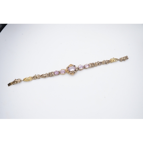 335 - A pink topaz bracelet, mid 19th century set with a sequence of five oval pink topazes, to a gold bra... 