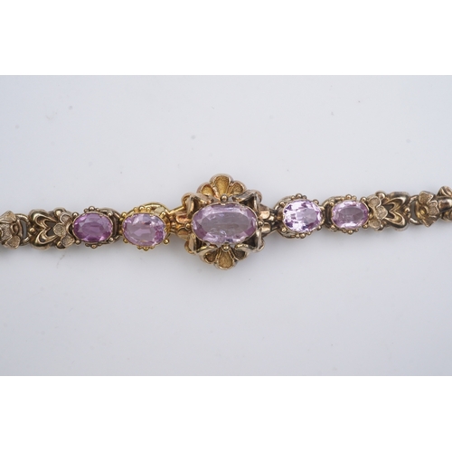 335 - A pink topaz bracelet, mid 19th century set with a sequence of five oval pink topazes, to a gold bra... 