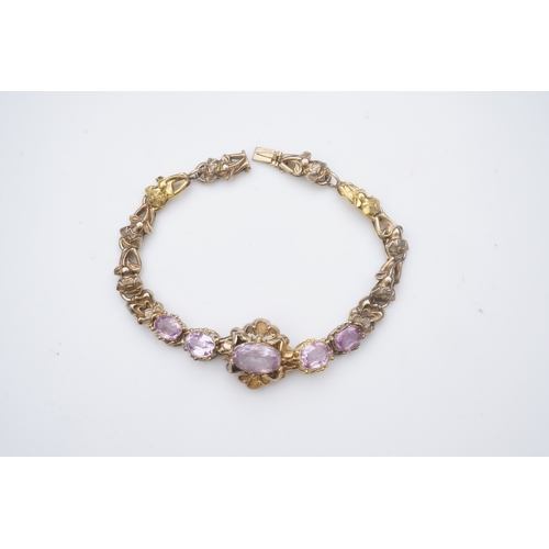 335 - A pink topaz bracelet, mid 19th century set with a sequence of five oval pink topazes, to a gold bra... 