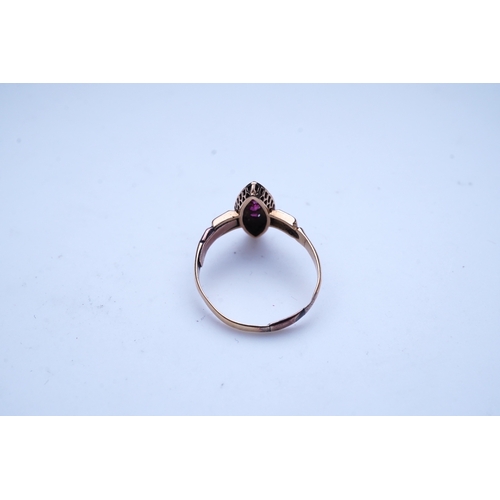 336 - A Victorian ruby and seed pearl ring, circa 1876, of navette outline, set with a vertical line of th... 