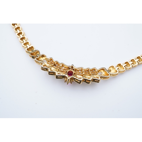 339 - A diamond and synthetic ruby necklace, set to the front with a cabochon synthetic ruby within a pavé... 