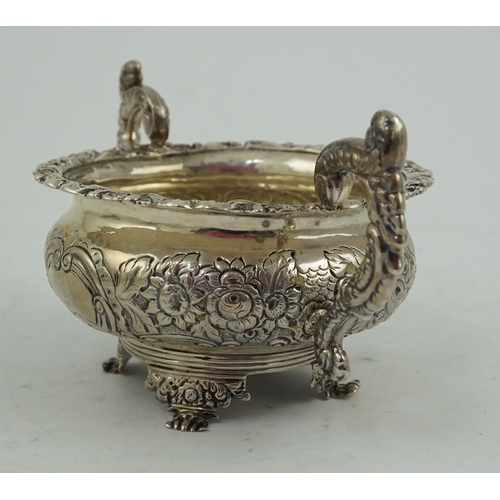 34 - A George IV Irish embossed silver two handled sugar bowl, by James Scott, with scroll handles and de... 