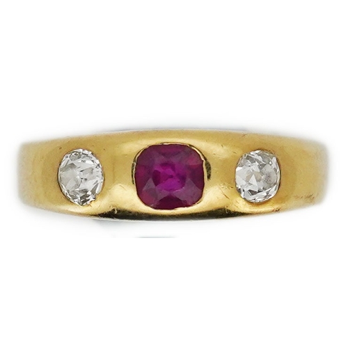 341 - A ruby and diamond three-stone ring, early 20th century, rubover-set with a cushion-shaped ruby betw... 