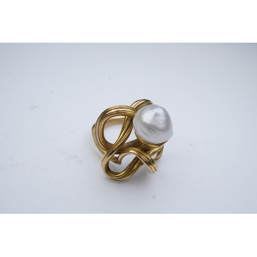 352 - A pearl ring, in the Art Nouveau style, designed as a sinuous tendril, set with a pearl measuring ap... 