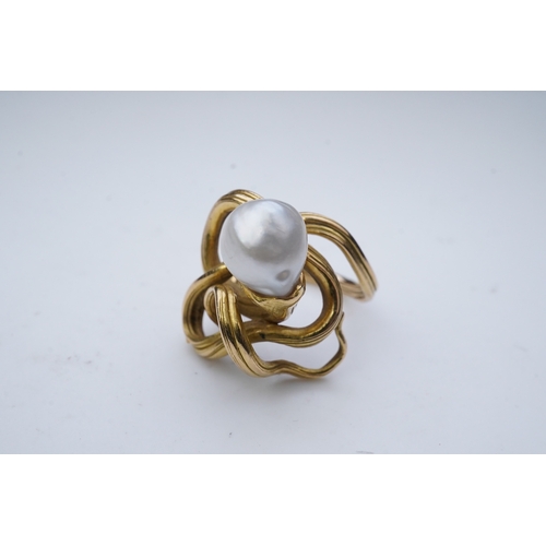 352 - A pearl ring, in the Art Nouveau style, designed as a sinuous tendril, set with a pearl measuring ap... 