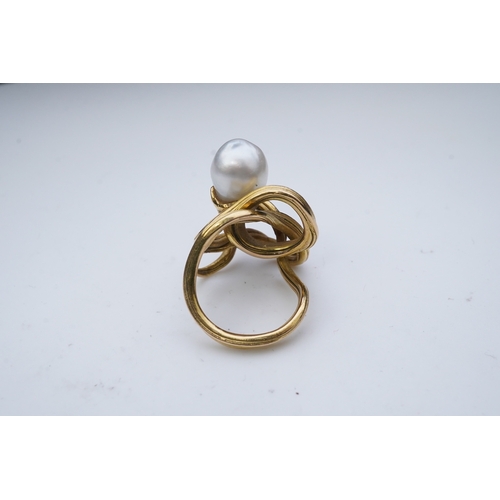 352 - A pearl ring, in the Art Nouveau style, designed as a sinuous tendril, set with a pearl measuring ap... 