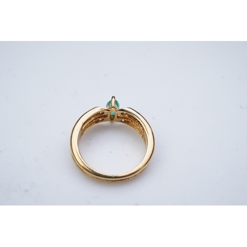 353 - An emerald and diamond ring, set with a marquise-shaped emerald, to a double band set with brilliant... 