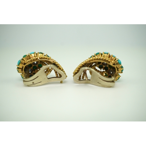 357 - A pair of turquoise and sapphire ear clips, 1960s each composed of curled rope twists of gold, set w... 