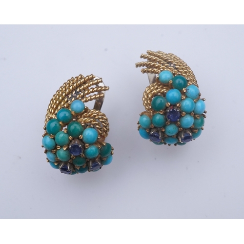 357 - A pair of turquoise and sapphire ear clips, 1960s each composed of curled rope twists of gold, set w... 