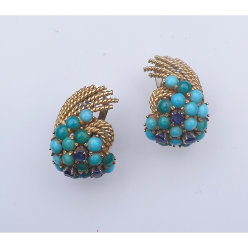 357 - A pair of turquoise and sapphire ear clips, 1960s each composed of curled rope twists of gold, set w... 