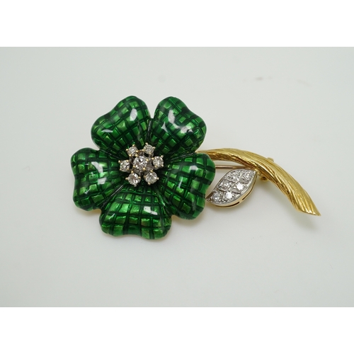 359 - An enamel and diamond brooch, designed as a flower, its petals applied with green enamel in a grid p... 