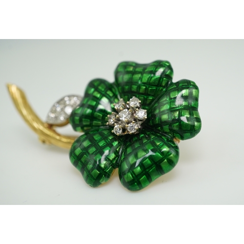 359 - An enamel and diamond brooch, designed as a flower, its petals applied with green enamel in a grid p... 