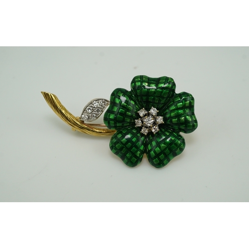 359 - An enamel and diamond brooch, designed as a flower, its petals applied with green enamel in a grid p... 