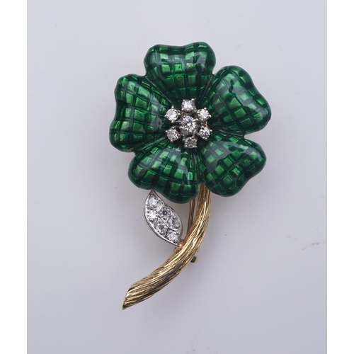 359 - An enamel and diamond brooch, designed as a flower, its petals applied with green enamel in a grid p... 