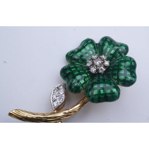 359 - An enamel and diamond brooch, designed as a flower, its petals applied with green enamel in a grid p... 