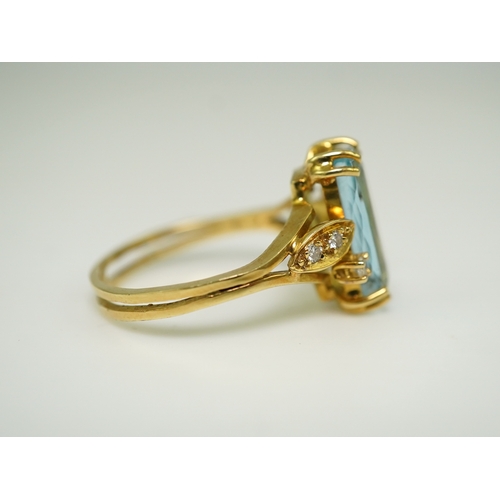 362 - An aquamarine and diamond ring, claw-set with an elongated cushion-shaped aquamarine measuring appro... 