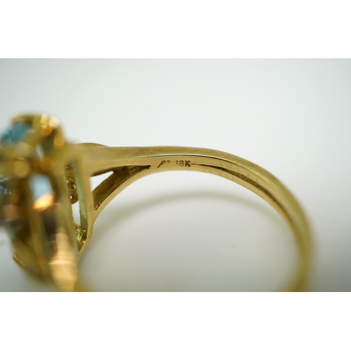 362 - An aquamarine and diamond ring, claw-set with an elongated cushion-shaped aquamarine measuring appro... 