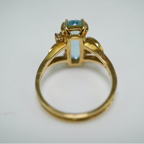 362 - An aquamarine and diamond ring, claw-set with an elongated cushion-shaped aquamarine measuring appro... 