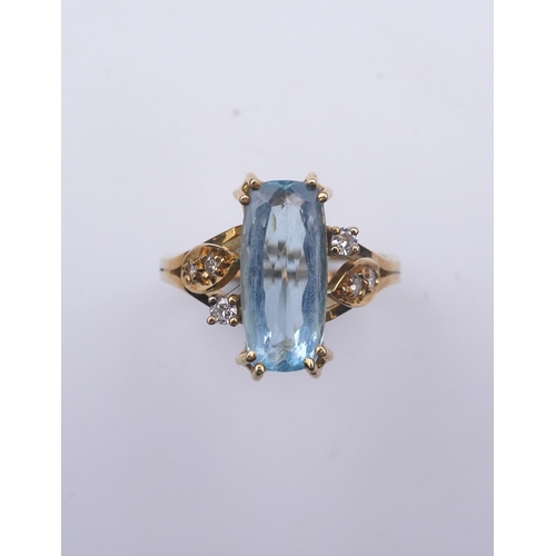 362 - An aquamarine and diamond ring, claw-set with an elongated cushion-shaped aquamarine measuring appro... 