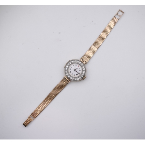 363 - A lady's 9ct gold and diamond cocktail watch, early 20th century and later, the circular white ename... 