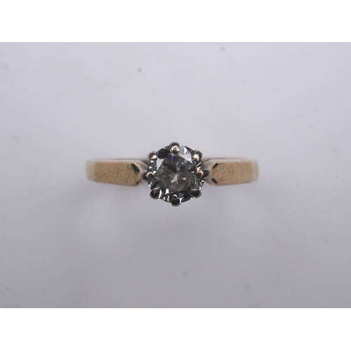 364 - A solitaire diamond ring, claw-set with a circular-cut diamond weighing approximately 0.60 carats, m... 