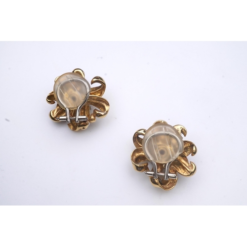 369 - A pair of Retro citrine and diamond ear clips, circa 1940, each designed as a flower, set with a clu... 