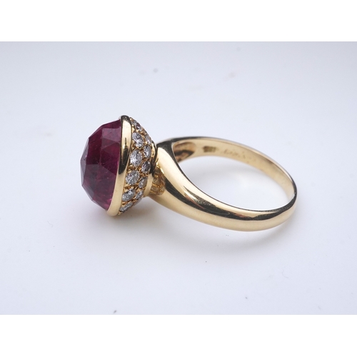 373 - Asprey, a pink tourmaline and diamond ring, set with an inverted oval pink tourmaline, the cup setti... 