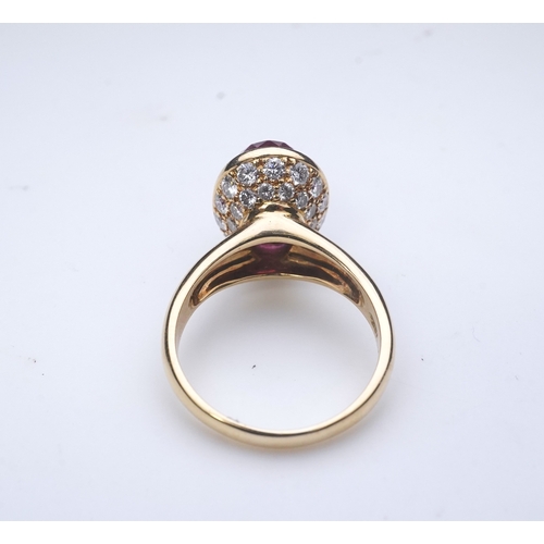 373 - Asprey, a pink tourmaline and diamond ring, set with an inverted oval pink tourmaline, the cup setti... 