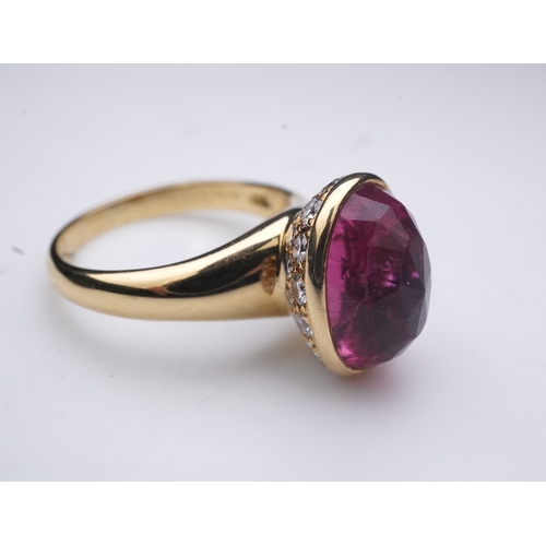 373 - Asprey, a pink tourmaline and diamond ring, set with an inverted oval pink tourmaline, the cup setti... 