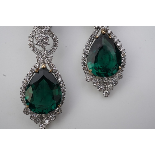 374 - A pair of synthetic green quartz and diamond earrings each of articulated pendent design, set with b... 