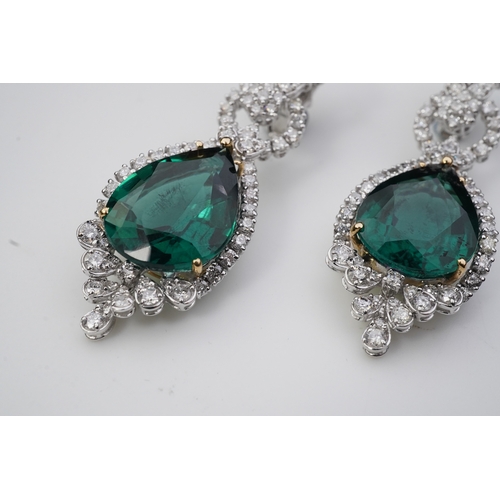 374 - A pair of synthetic green quartz and diamond earrings each of articulated pendent design, set with b... 