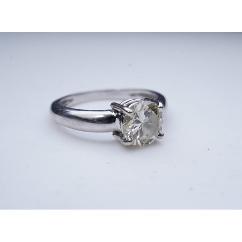 376 - A solitaire diamond ring, claw-set with a brilliant-cut diamond weighing approximately 1.20 carats, ... 