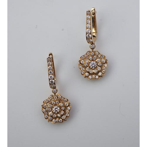 378 - Garrard, a pair of diamond 'Tudor Rose Mini Icon' earrings each suspending a Tudor Rose motif, pavé-... 