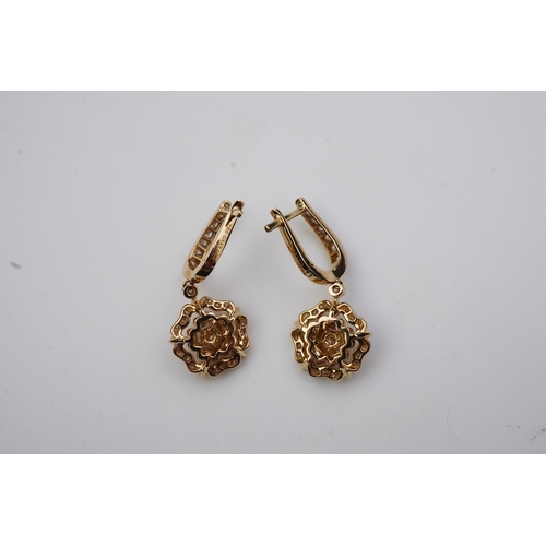 378 - Garrard, a pair of diamond 'Tudor Rose Mini Icon' earrings each suspending a Tudor Rose motif, pavé-... 