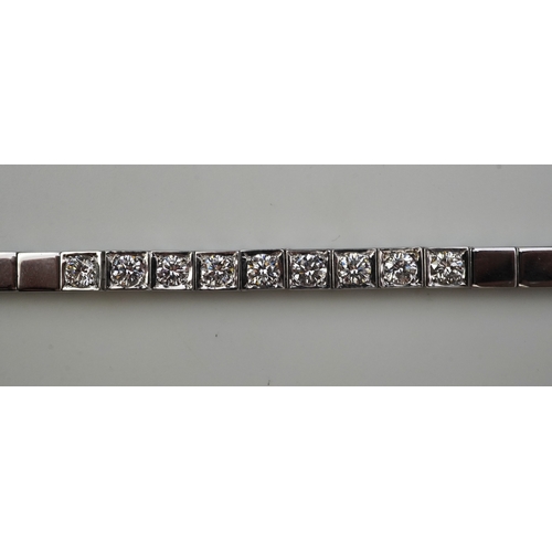 379 - A diamond line bracelet set to the centre with a line of brilliant-cut diamonds totalling approximat... 