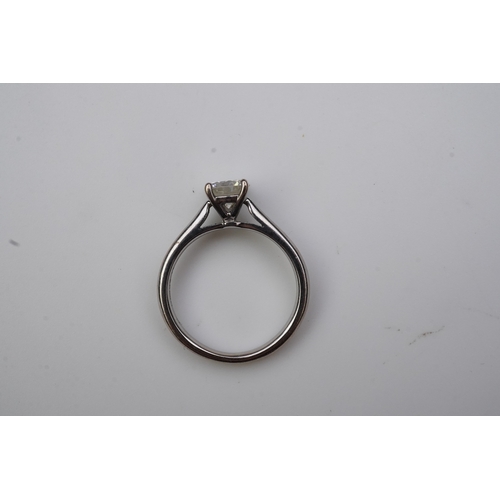 380 - A solitaire diamond ring, claw-set with a brilliant-cut diamond weighing approximately 0.65 carats, ... 