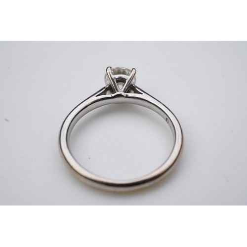 380 - A solitaire diamond ring, claw-set with a brilliant-cut diamond weighing approximately 0.65 carats, ... 