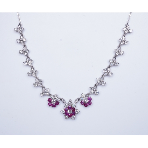 383 - A ruby and diamond necklace the front composed of floral links set with antique circular-cut and sin... 