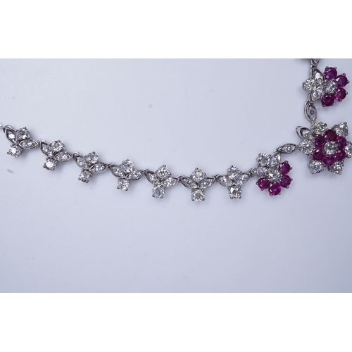 383 - A ruby and diamond necklace the front composed of floral links set with antique circular-cut and sin... 