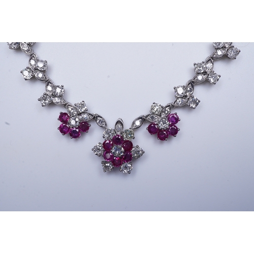 383 - A ruby and diamond necklace the front composed of floral links set with antique circular-cut and sin... 