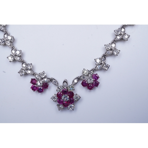 383 - A ruby and diamond necklace the front composed of floral links set with antique circular-cut and sin... 